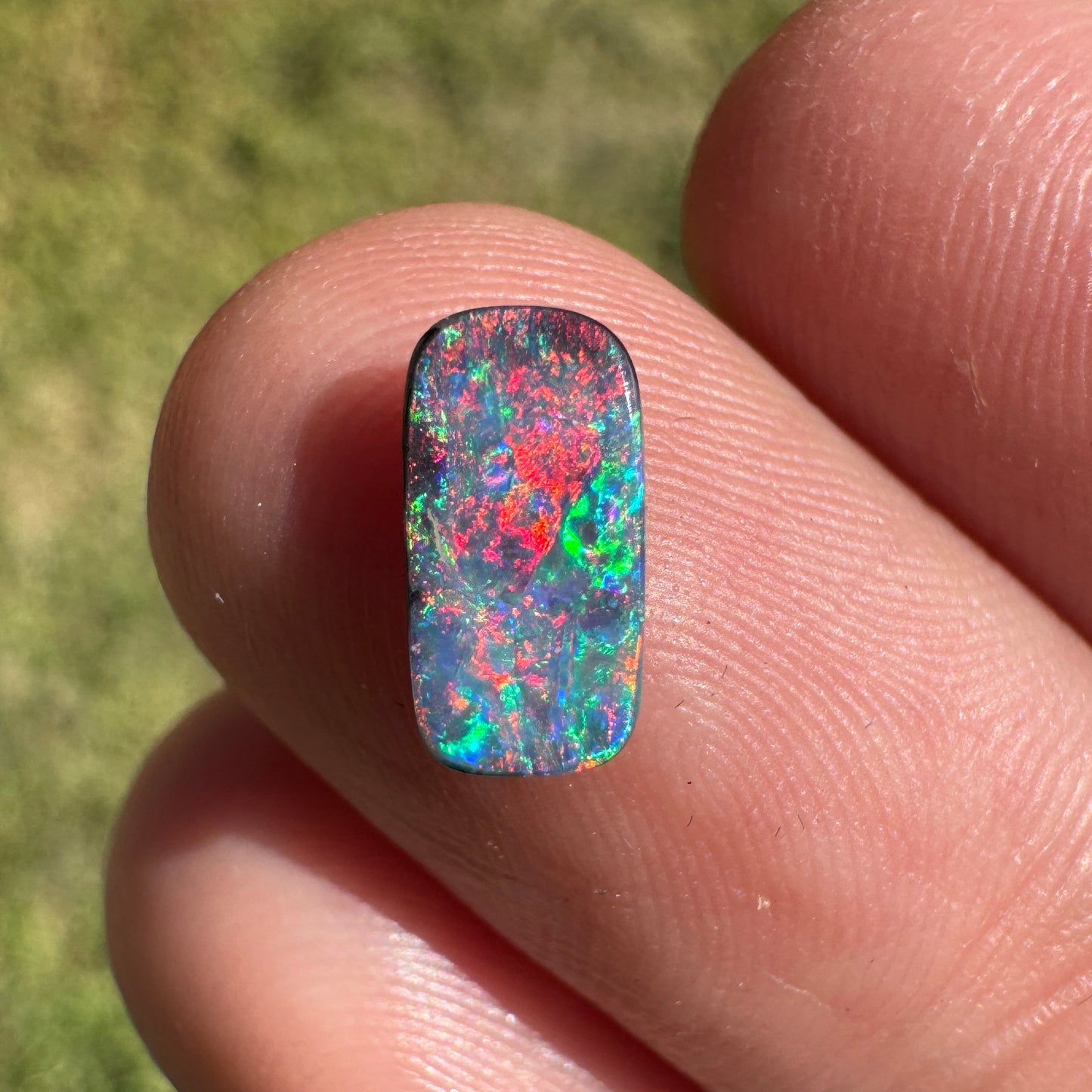 0.55 Ct extra small red and pink boulder opal