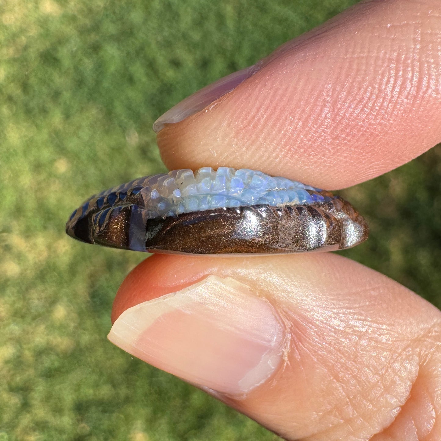 23.41 Ct fan shell boulder opal carving