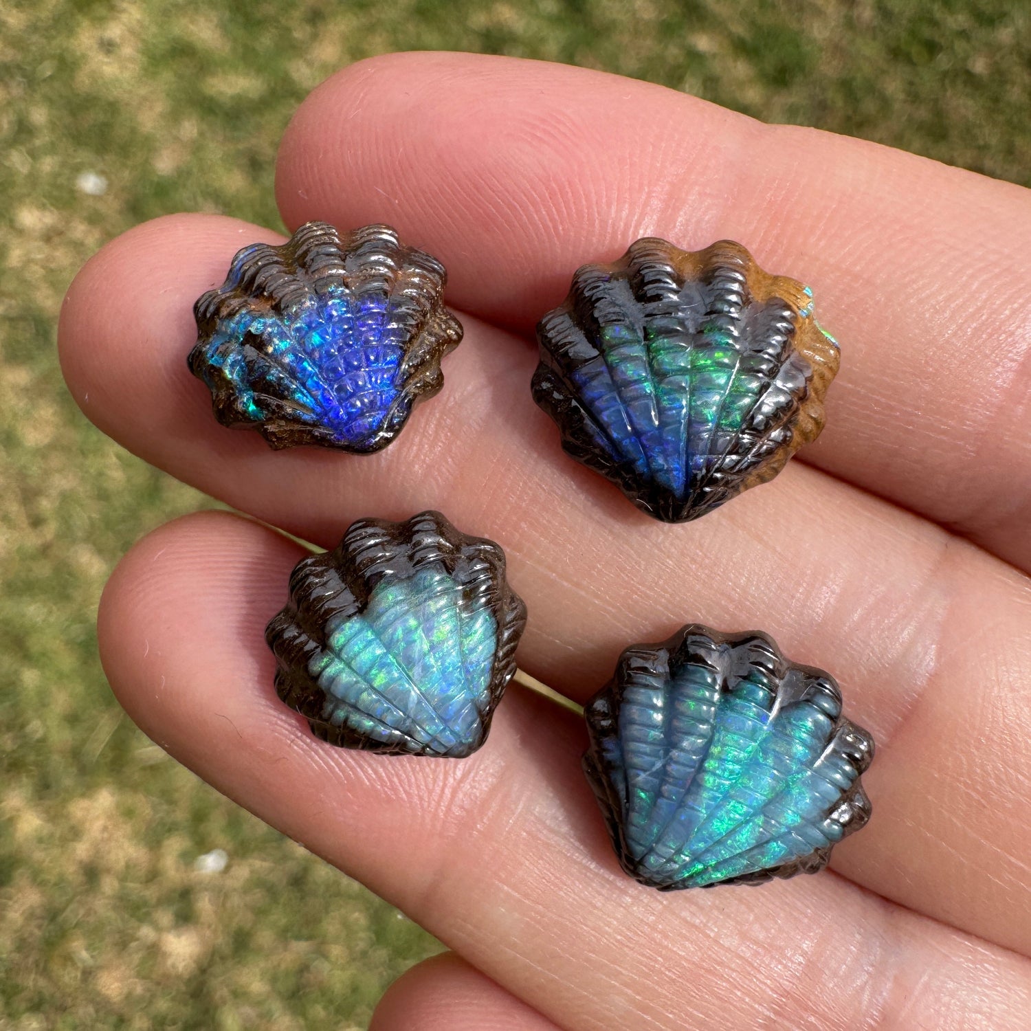 Fan shell opal carvings