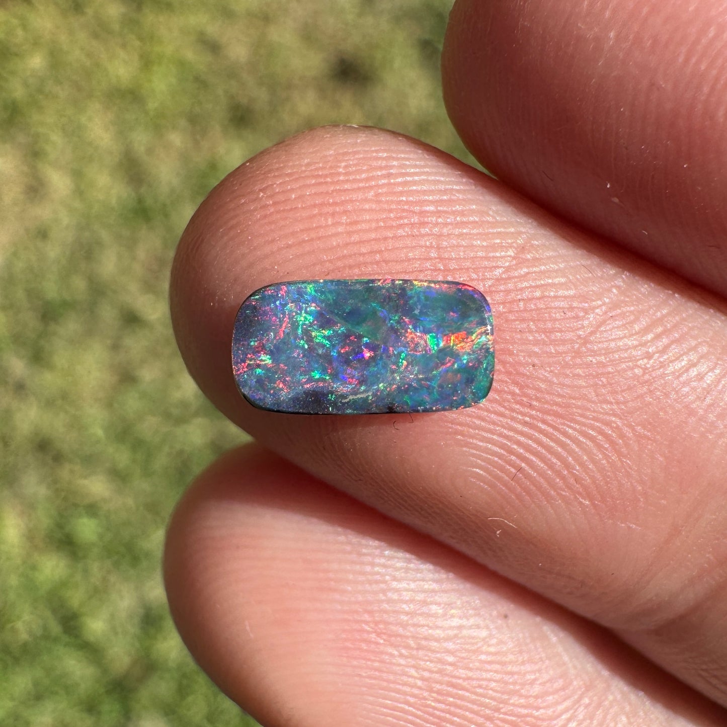0.55 Ct extra small red and pink boulder opal