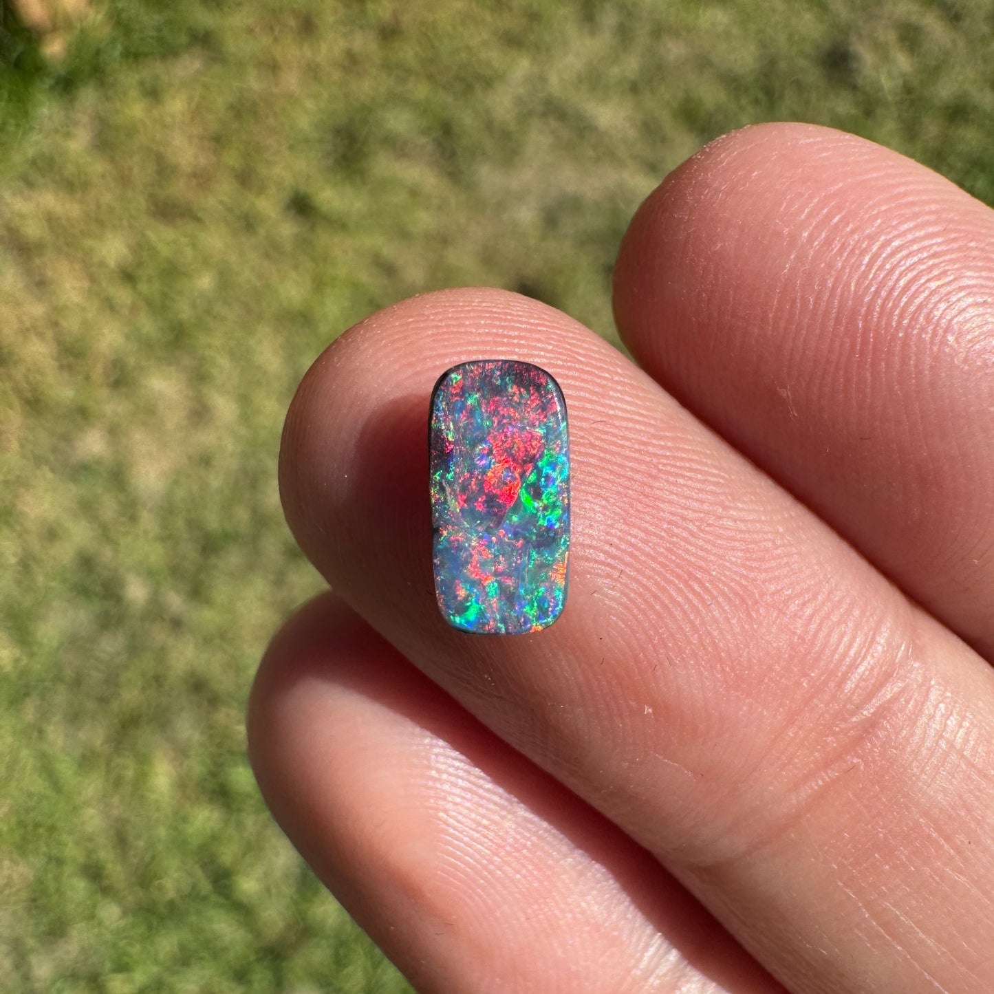 0.55 Ct extra small red and pink boulder opal