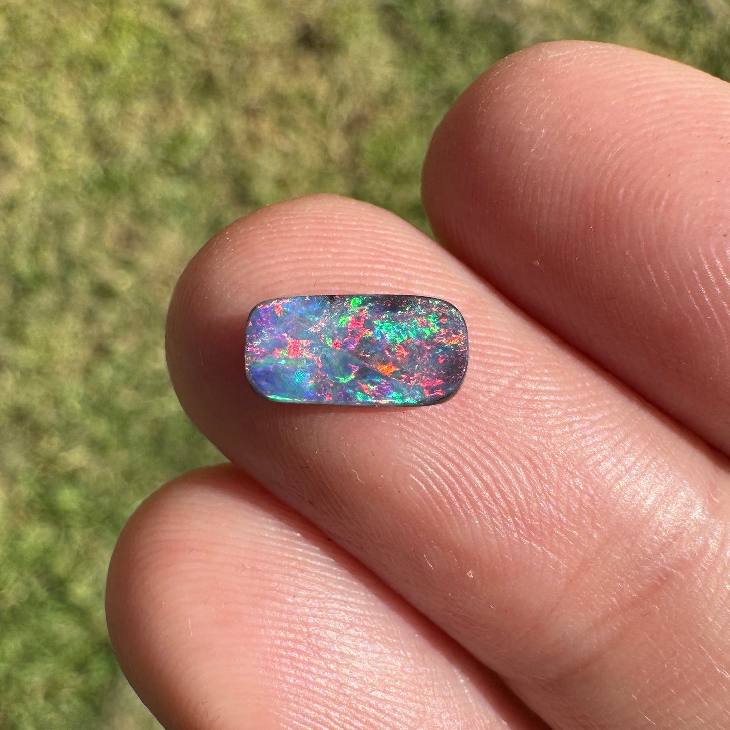 0.55 Ct extra small red and pink boulder opal