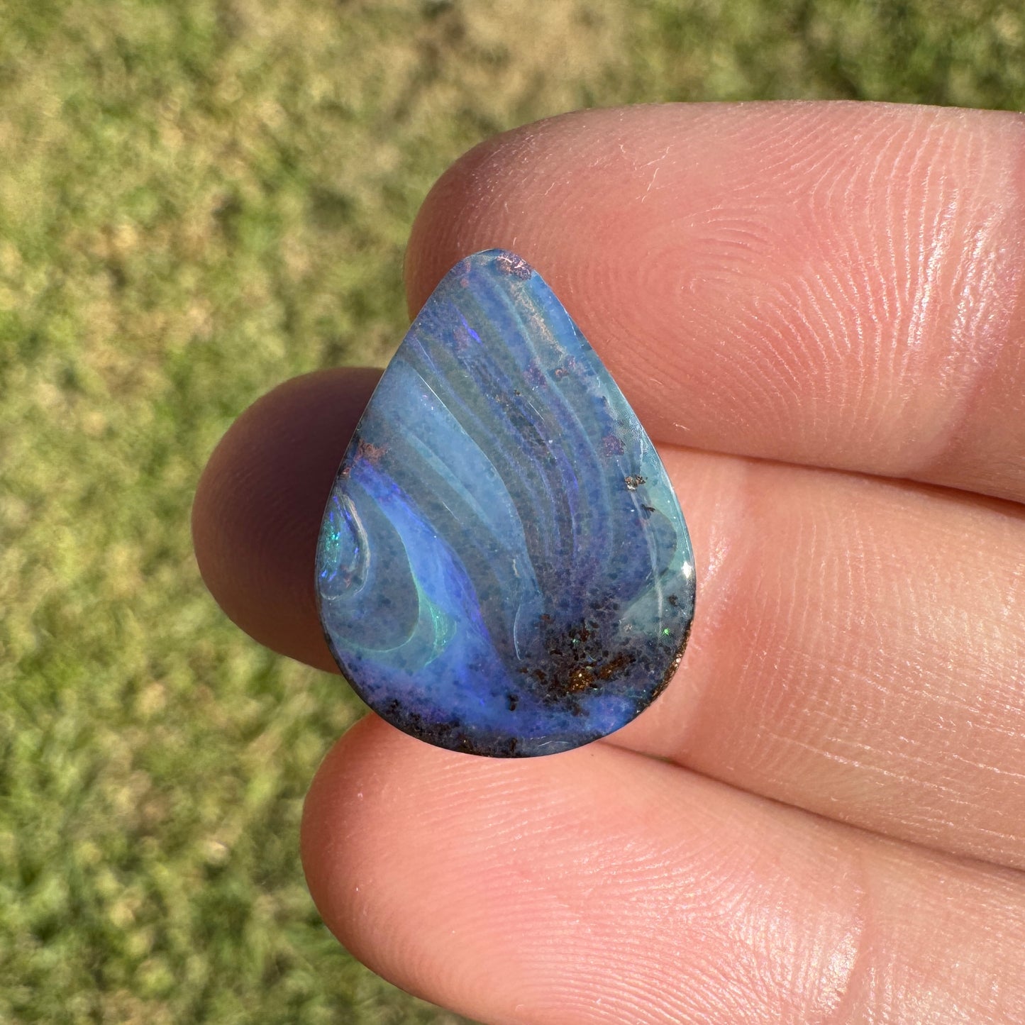 9.37 Ct swirly blue teardrop boulder opal