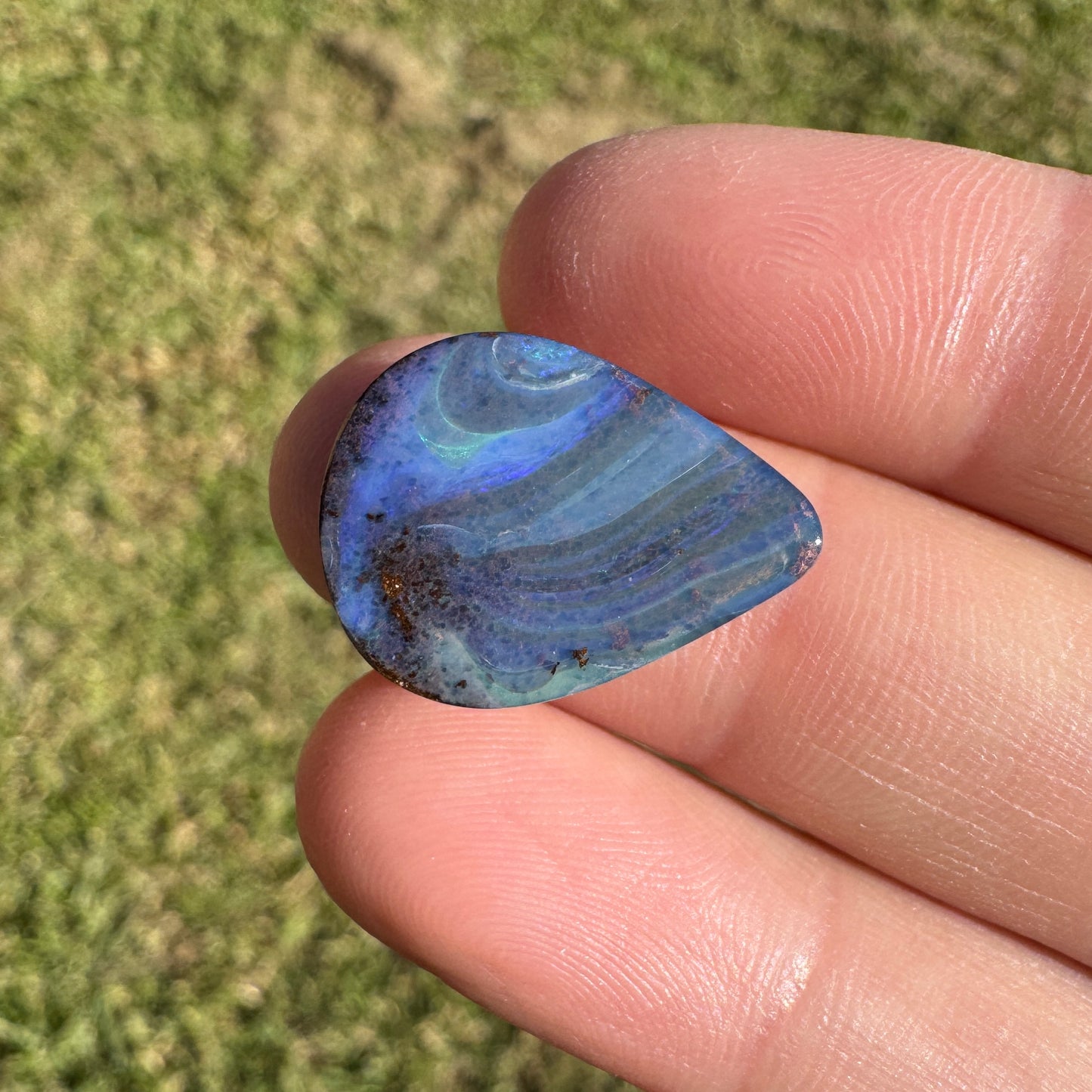9.37 Ct swirly blue teardrop boulder opal
