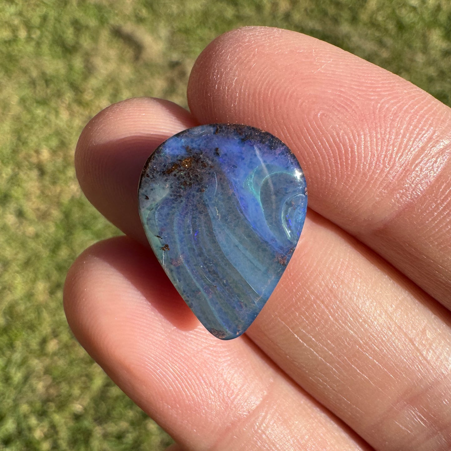 9.37 Ct swirly blue teardrop boulder opal