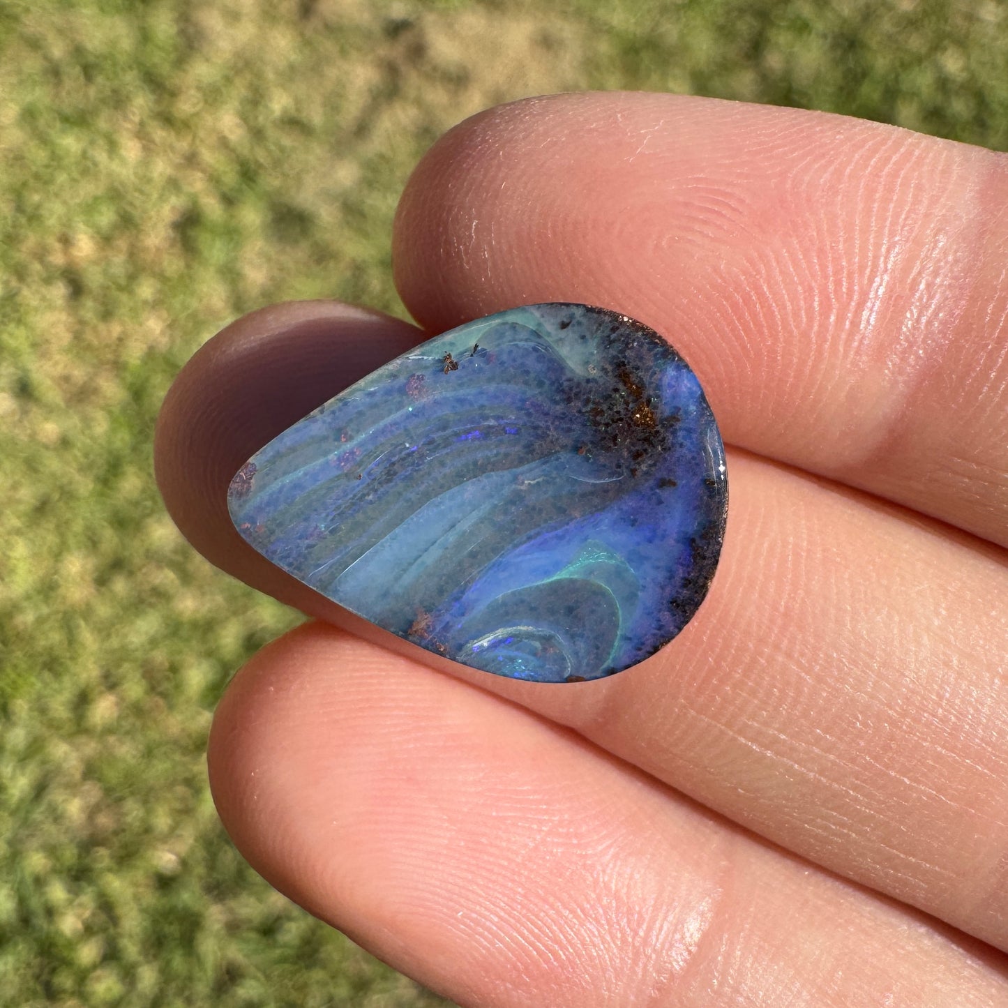 9.37 Ct swirly blue teardrop boulder opal