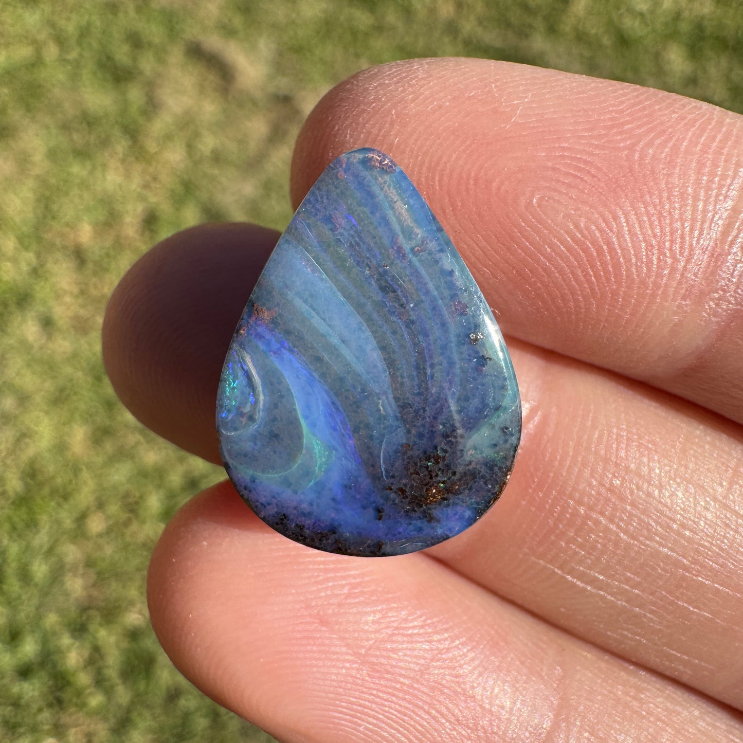9.37 Ct swirly blue teardrop boulder opal