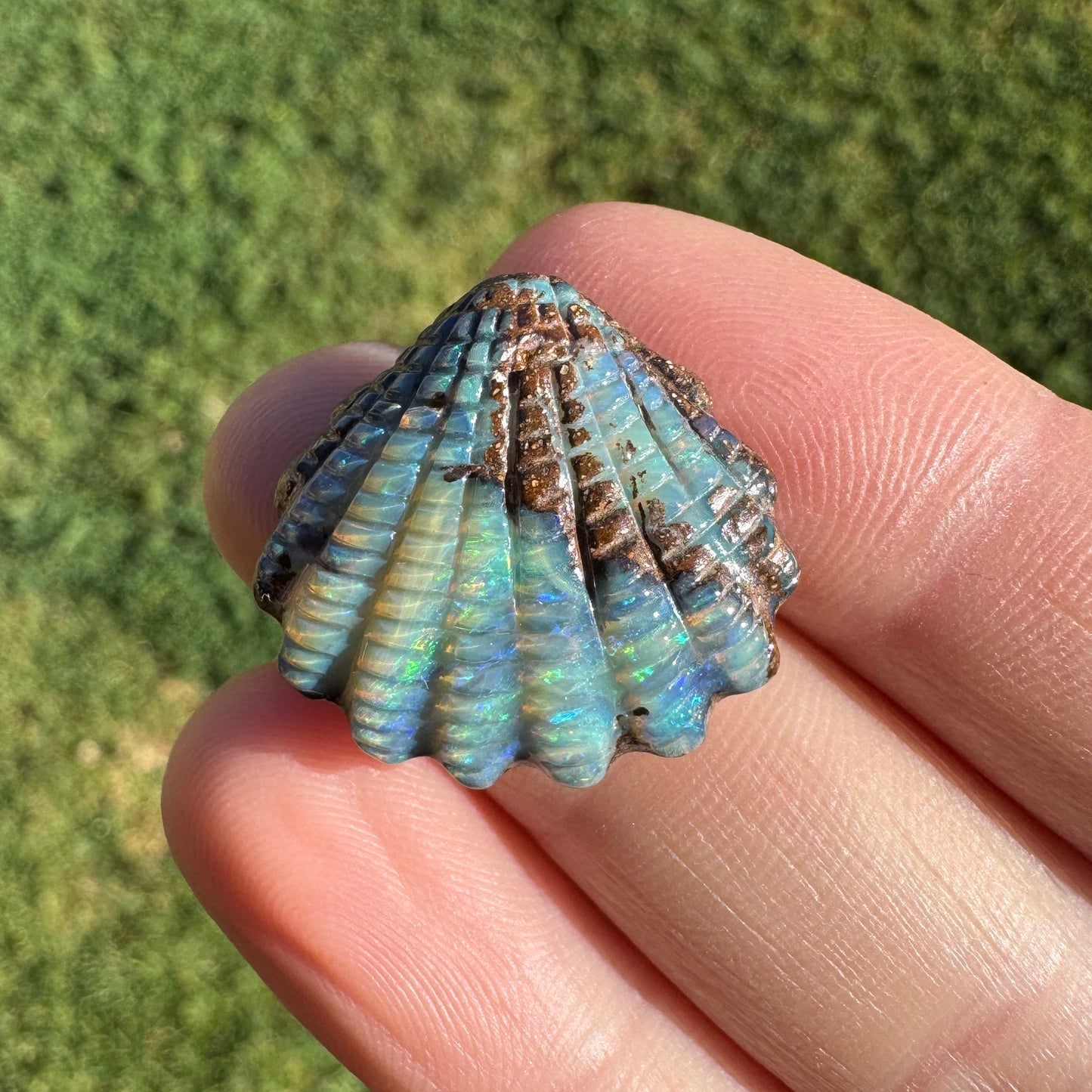 16.82 Ct fan shell boulder opal carving