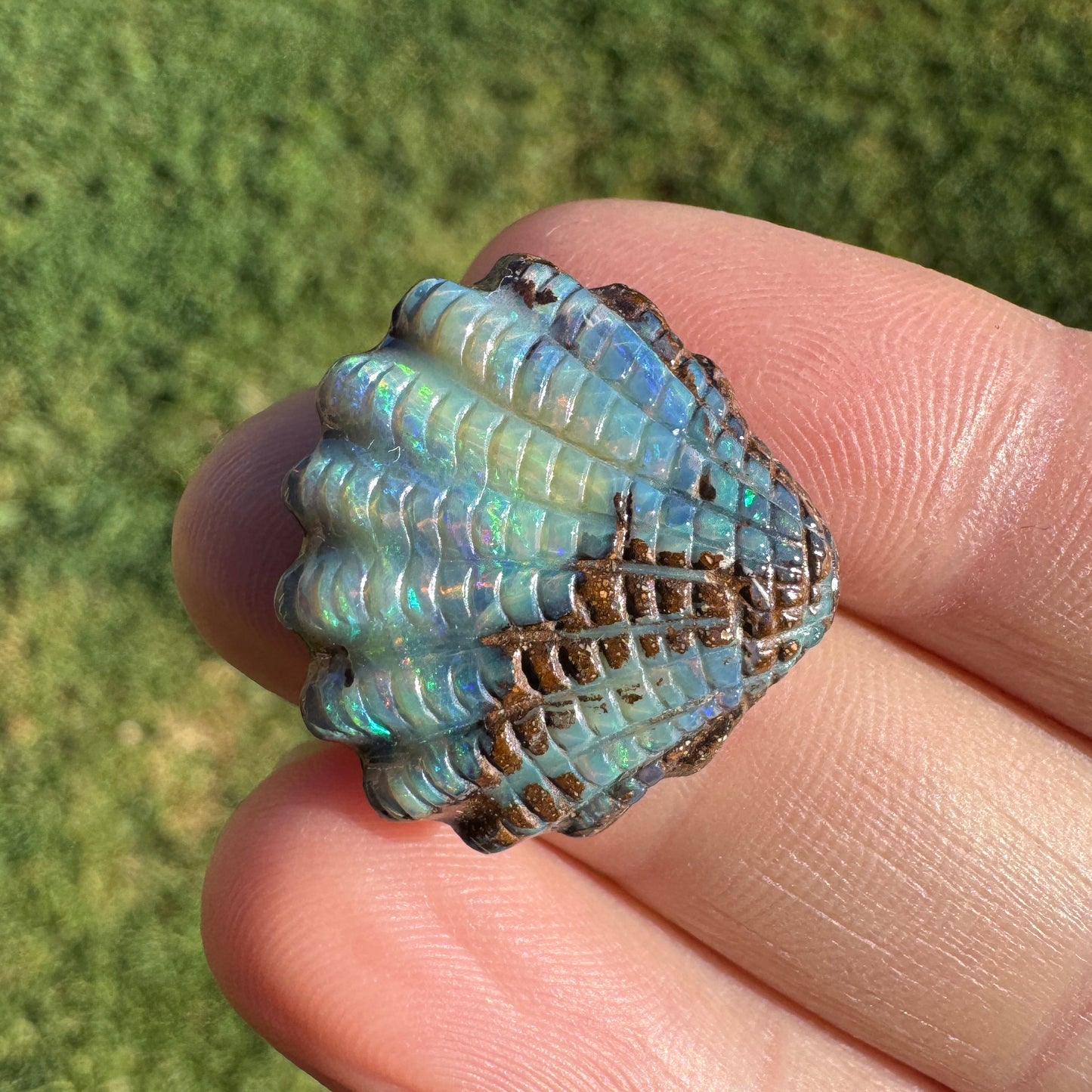 16.82 Ct fan shell boulder opal carving