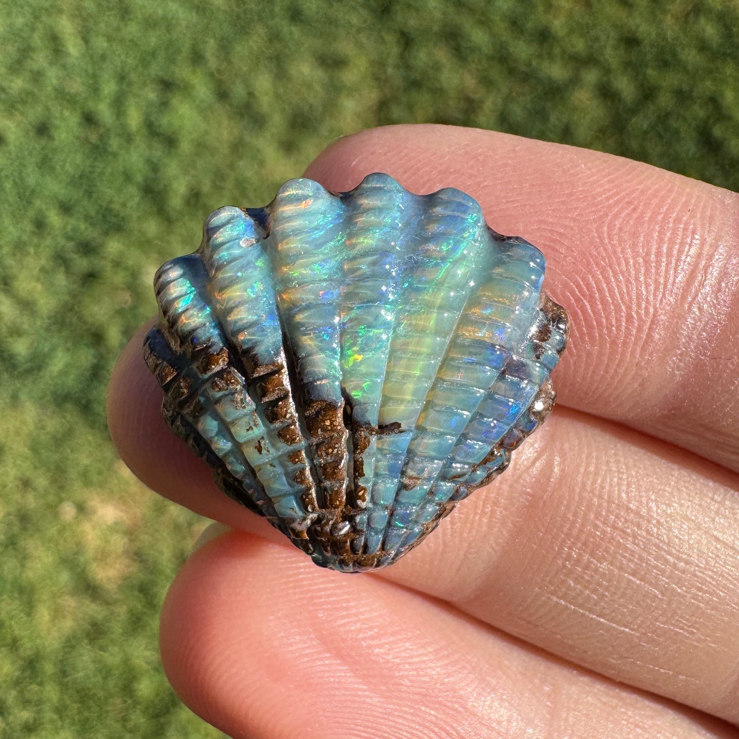 16.82 Ct fan shell boulder opal carving