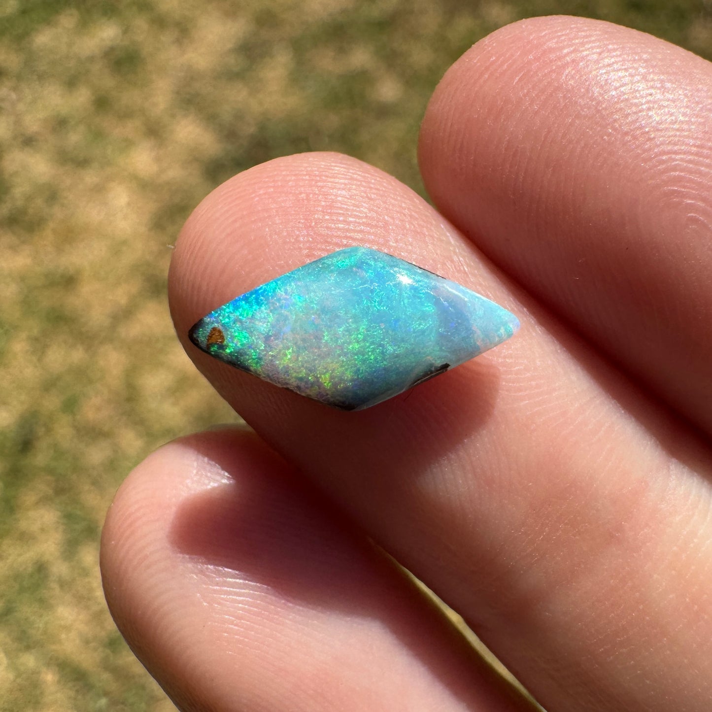 1.69 Ct small diamond shaped boulder opal